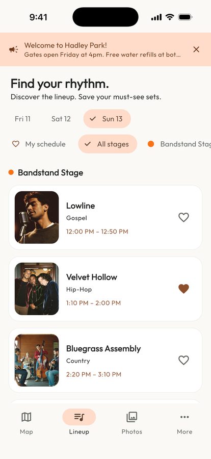 Bira attendee demo lineup listing the day’s sets by stage, each with an artist photo, set times and a heart to save it to my schedule